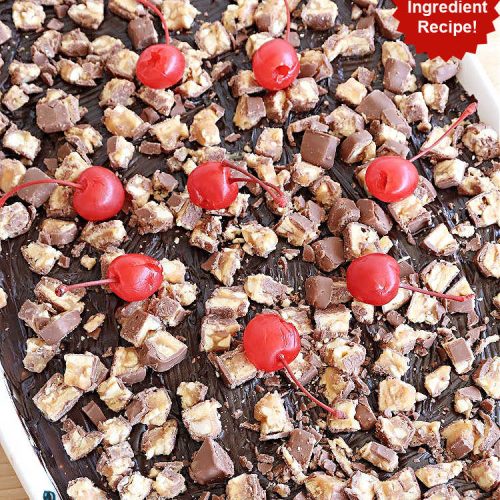 Snickers Éclair Dessert | Can't Stay Out of the Kitchen | this easy-peasy 6-ingredient #recipe is spectacular for company, potlucks or special occasions like #ValentinesDay. It includes layers of #ChocolatePudding, #GrahamCrackers, #ChocolateIcing and #SnickersCandyBars on top. The #Snickers give it that wonderful chocolaty & #caramel flavor along with #peanuts that adds a little punch to the #dessert. So easy even a child can make it! #Éclairs #ÉclairDessert #SnickersÉclairDessert
