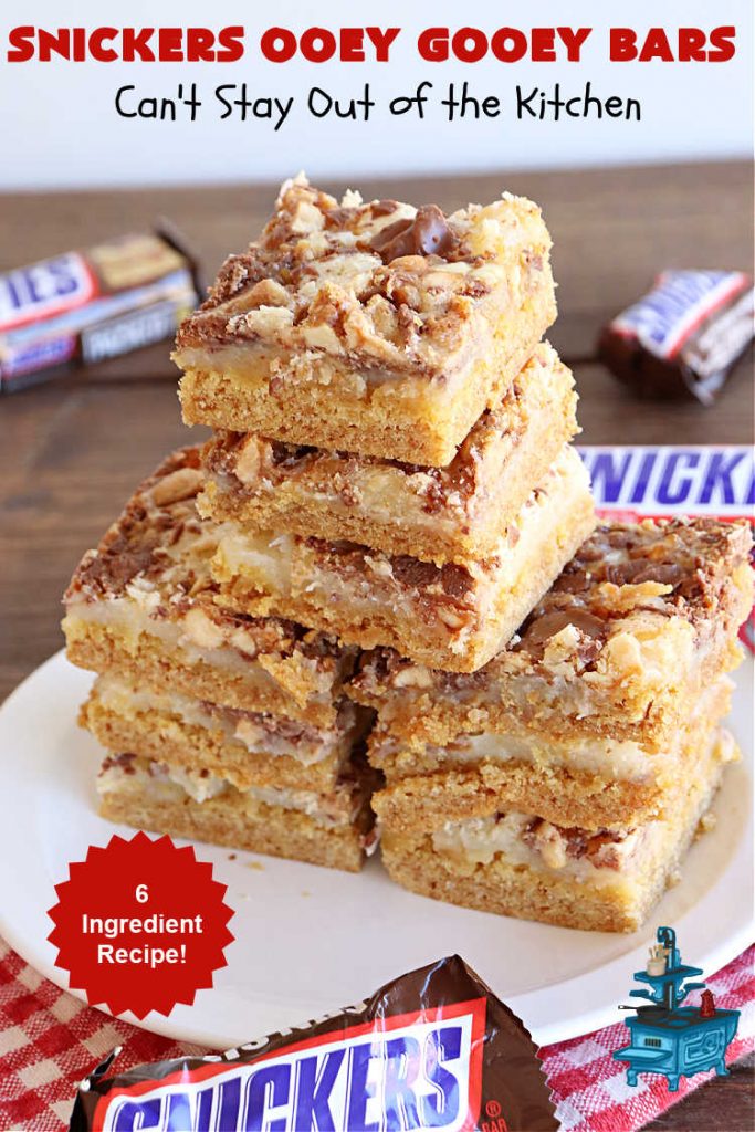 Snickers Ooey Gooey Bars | Can't Stay Out of the Kitchen | these luscious #OoeyGooeyBars contain a #cheesecake layer & they're topped with #SnickersBars for a lovely #chocolate & #PeanutButter flavor that will win over all your family & friends. This 6-ingredient #recipe is perfect for #tailgating parties, potlucks or a #ChristmasCookieExchange. It's easy to whip up & everyone loves them! #holiday #HolidayDessert #SnickersDessert #dessert #brownie #SnickersOoeyGooeyBars