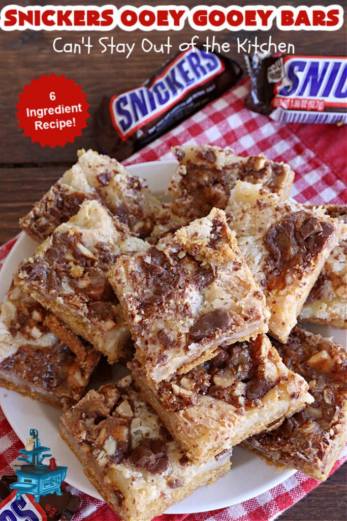 Snickers Ooey Gooey Bars | Can't Stay Out of the Kitchen | these luscious #OoeyGooeyBars contain a #cheesecake layer & they're topped with #SnickersBars for a lovely #chocolate & #PeanutButter flavor that will win over all your family & friends. This 6-ingredient #recipe is perfect for #tailgating parties, potlucks or a #ChristmasCookieExchange. It's easy to whip up & everyone loves them! #holiday #HolidayDessert #SnickersDessert #dessert #brownie #SnickersOoeyGooeyBars
