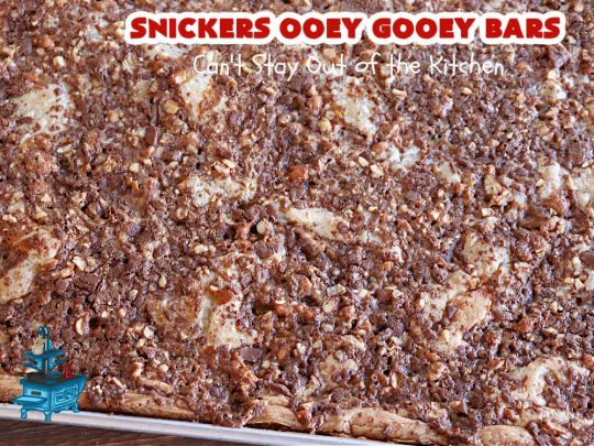 Snickers Ooey Gooey Bars | Can't Stay Out of the Kitchen | these luscious #OoeyGooeyBars contain a #cheesecake layer & they're topped with #SnickersBars for a lovely #chocolate & #PeanutButter flavor that will win over all your family & friends. This 6-ingredient #recipe is perfect for #tailgating parties, potlucks or a #ChristmasCookieExchange. It's easy to whip up & everyone loves them! #holiday #HolidayDessert #SnickersDessert #dessert #brownie #SnickersOoeyGooeyBars