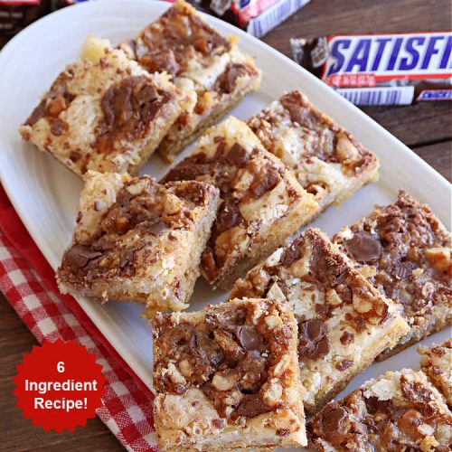 Snickers Ooey Gooey Bars | Can't Stay Out of the Kitchen | these luscious #OoeyGooeyBars contain a #cheesecake layer & they're topped with #SnickersBars for a lovely #chocolate & #PeanutButter flavor that will win over all your family & friends. This 6-ingredient #recipe is perfect for #tailgating parties, potlucks or a #ChristmasCookieExchange. It's easy to whip up & everyone loves them! #holiday #HolidayDessert #SnickersDessert #dessert #brownie #SnickersOoeyGooeyBars