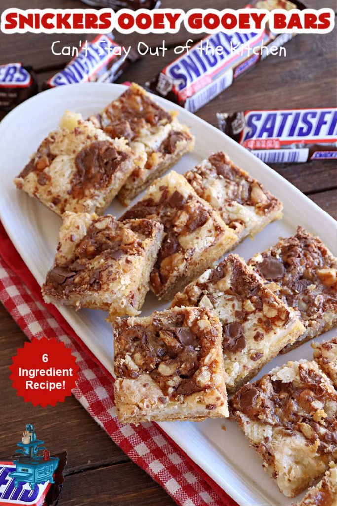 Snickers Ooey Gooey Bars | Can't Stay Out of the Kitchen | these luscious #OoeyGooeyBars contain a #cheesecake layer & they're topped with #SnickersBars for a lovely #chocolate & #PeanutButter flavor that will win over all your family & friends. This 6-ingredient #recipe is perfect for #tailgating parties, potlucks or a #ChristmasCookieExchange. It's easy to whip up & everyone loves them! #holiday #HolidayDessert #SnickersDessert #dessert #brownie #SnickersOoeyGooeyBars