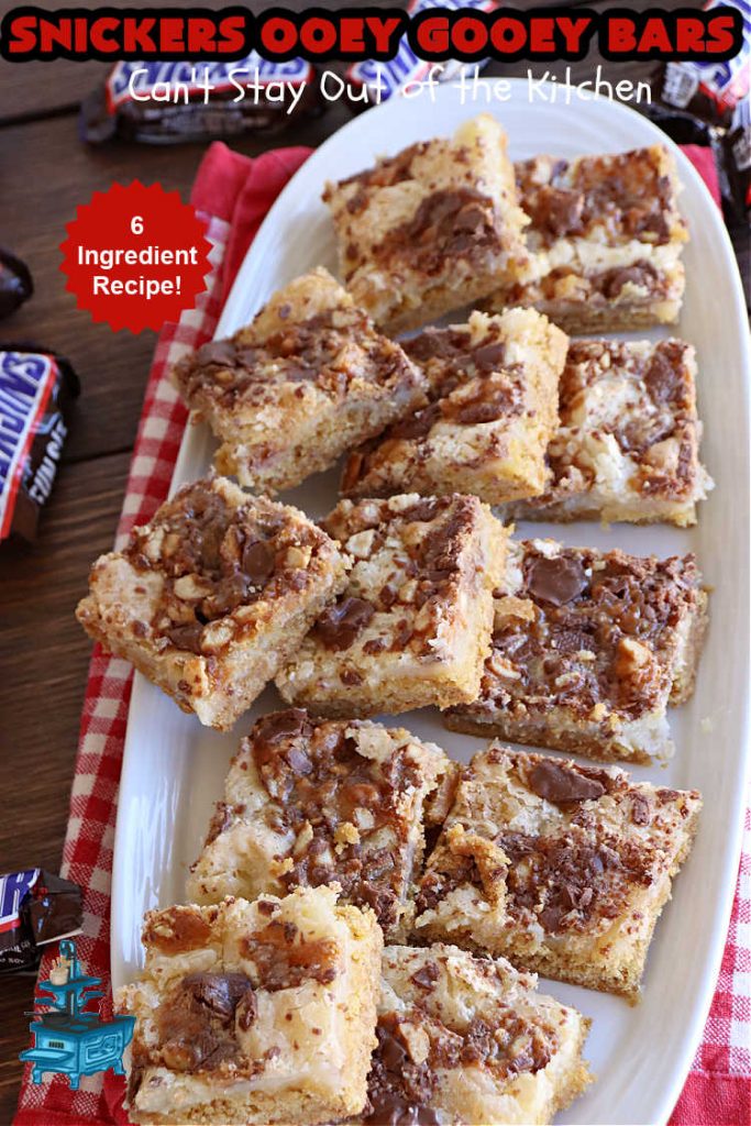 Snickers Ooey Gooey Bars | Can't Stay Out of the Kitchen | these luscious #OoeyGooeyBars contain a #cheesecake layer & they're topped with #SnickersBars for a lovely #chocolate & #PeanutButter flavor that will win over all your family & friends. This 6-ingredient #recipe is perfect for #tailgating parties, potlucks or a #ChristmasCookieExchange. It's easy to whip up & everyone loves them! #holiday #HolidayDessert #SnickersDessert #dessert #brownie #SnickersOoeyGooeyBars