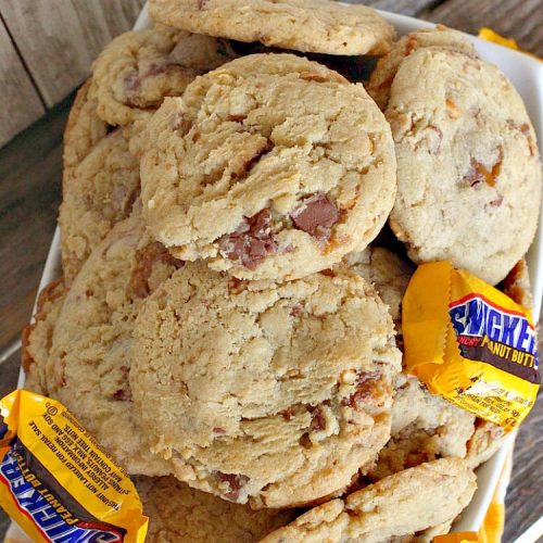 Snickers Peanut Butter Cookies | Can't Stay Out of the Kitchen | these luscious #cookies are loaded with #SnickersPeanutButterBars. The #caramel, #chocolate & #PeanutButter flavors really come through making this one dynamite #dessert. If you enjoy #SnickersCandyBars, you'll rave over this #SnickersDessert. #PeanutButterDessert #ChocolateDessert #HolidayDessert #CaramelDessert #SnickersPeanutButterCookies #tailgating #ChristmasCookieExchange