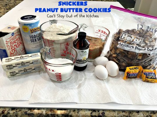 Snickers Peanut Butter Cookies | Can't Stay Out of the Kitchen | these luscious #cookies are loaded with #SnickersPeanutButterBars. The #caramel, #chocolate & #PeanutButter flavors really come through making this one dynamite #dessert. If you enjoy #SnickersCandyBars, you'll rave over this #SnickersDessert. #PeanutButterDessert #ChocolateDessert #HolidayDessert #CaramelDessert #SnickersPeanutButterCookies #tailgating #ChristmasCookieExchange