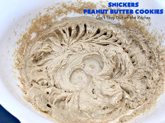 Snickers Peanut Butter Cookies | Can't Stay Out of the Kitchen | these luscious #cookies are loaded with #SnickersPeanutButterBars. The #caramel, #chocolate & #PeanutButter flavors really come through making this one dynamite #dessert. If you enjoy #SnickersCandyBars, you'll rave over this #SnickersDessert. #PeanutButterDessert #ChocolateDessert #HolidayDessert #CaramelDessert #SnickersPeanutButterCookies #tailgating #ChristmasCookieExchange