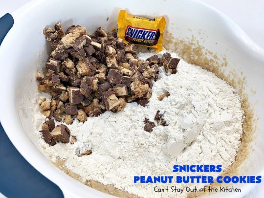 Snickers Peanut Butter Cookies | Can't Stay Out of the Kitchen | these luscious #cookies are loaded with #SnickersPeanutButterBars. The #caramel, #chocolate & #PeanutButter flavors really come through making this one dynamite #dessert. If you enjoy #SnickersCandyBars, you'll rave over this #SnickersDessert. #PeanutButterDessert #ChocolateDessert #HolidayDessert #CaramelDessert #SnickersPeanutButterCookies #tailgating #ChristmasCookieExchange