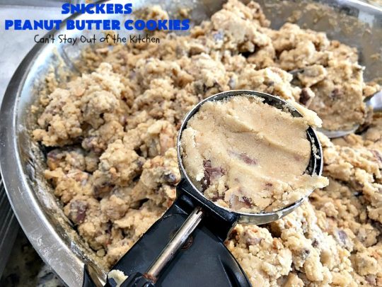 Snickers Peanut Butter Cookies | Can't Stay Out of the Kitchen | these luscious #cookies are loaded with #SnickersPeanutButterBars. The #caramel, #chocolate & #PeanutButter flavors really come through making this one dynamite #dessert. If you enjoy #SnickersCandyBars, you'll rave over this #SnickersDessert. #PeanutButterDessert #ChocolateDessert #HolidayDessert #CaramelDessert #SnickersPeanutButterCookies #tailgating #ChristmasCookieExchange