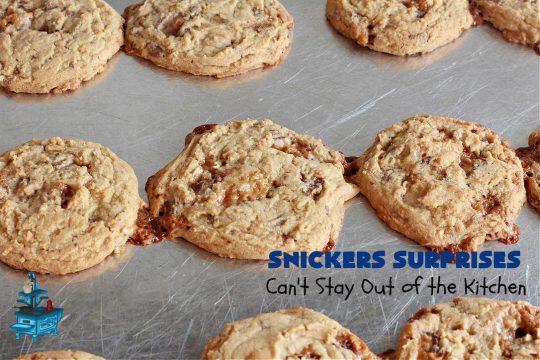 Snickers Surprises | Can't Stay Out of the Kitchen | these scrumptious #PeanutButterCookies include #SnickersBars so they have a little bit of #caramel, #chocolate & #PeanutButter in every bite. You're sure to swoon once you get a taste of these jewels. Perfect for #tailgating, potlucks, backyard BBQs and #holiday #baking. #ChristmasCookieExchange #dessert #ChocolateDessert #SnickersDessert #PeanutButterDessert #CaramelDessert #cookies #SnickersSurprises