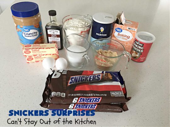 Snickers Surprises | Can't Stay Out of the Kitchen | these scrumptious #PeanutButterCookies include #SnickersBars so they have a little bit of #caramel, #chocolate & #PeanutButter in every bite. You're sure to swoon once you get a taste of these jewels. Perfect for #tailgating, potlucks, backyard BBQs and #holiday #baking. #ChristmasCookieExchange #dessert #ChocolateDessert #SnickersDessert #PeanutButterDessert #CaramelDessert #cookies #SnickersSurprises