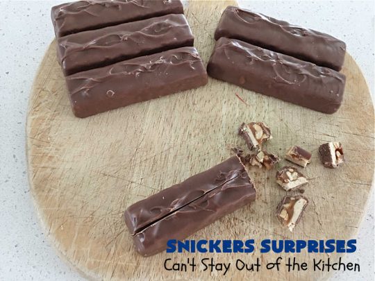 Snickers Surprises | Can't Stay Out of the Kitchen | these scrumptious #PeanutButterCookies include #SnickersBars so they have a little bit of #caramel, #chocolate & #PeanutButter in every bite. You're sure to swoon once you get a taste of these jewels. Perfect for #tailgating, potlucks, backyard BBQs and #holiday #baking. #ChristmasCookieExchange #dessert #ChocolateDessert #SnickersDessert #PeanutButterDessert #CaramelDessert #cookies #SnickersSurprises
