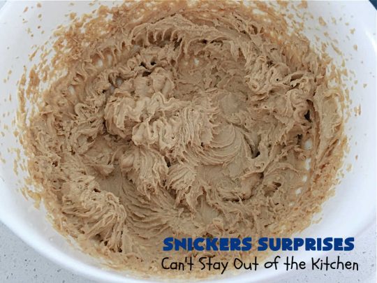 Snickers Surprises | Can't Stay Out of the Kitchen | these scrumptious #PeanutButterCookies include #SnickersBars so they have a little bit of #caramel, #chocolate & #PeanutButter in every bite. You're sure to swoon once you get a taste of these jewels. Perfect for #tailgating, potlucks, backyard BBQs and #holiday #baking. #ChristmasCookieExchange #dessert #ChocolateDessert #SnickersDessert #PeanutButterDessert #CaramelDessert #cookies #SnickersSurprises