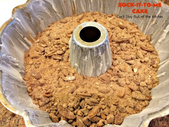 Sock-It-To-Me Cake | Can't Stay Out of the Kitchen | this fantastic #cake will knock your socks off! It has a lovely #pecan streusel filling in the middle & it's glazed with vanilla icing. We serve this as a #coffeecake for #breakfast or for #dessert. #Brunch #Holiday #cinnamon #HolidayBreakfast #SockItToMeCake 
