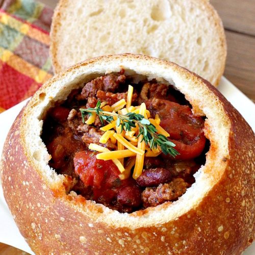 Spiced Chili in Bread Bowls | Can't Stay Out of the Kitchen | this fantastic #chili #recipe is so easy since it's made in the #SlowCooker. You can serve it in #BreadBowls or not. Great for #tailgating parties & cold, winter nights when comfort food is on the menu. #TexMex #CheddarCheese #KidneyBeans #GroundBeef #SpicedChiliInBreadBowls #CincoDeMayo