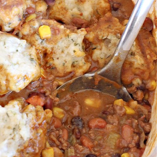 Spicy Bean Chili with Herb Dumplings | Can't Stay Out of the Kitchen | this fantastic #chili #recipe includes 4 kinds of #beans, #ChipotlePeppers in #AdoboSauce & #GreenChilies to make it sizzle. The #HerbDumplings are light & airy & add mouthwatering goodness to every bite. This #GlutenFree entree is wonderful reheated too. #BlackBeans #beef #KidneyBeans #ChiliBeans #corn #dumplings #SpicyBeanChili #SpicyBeanChiliWithHerbDumplings #TexMex