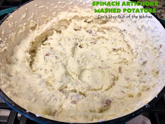 Spinach Artichoke Mashed Potatoes | Can't Stay Out of the Kitchen | this is a dynamic way to eat #mashedpotatoes. This one includes #creamcheese and sour cream along with #spinach, #artichokes & roasted #garlic. It's a terrific #sidedish for any meal but particularly delightful for company & #holidays like #Thanksgiving or #Christmas. #glutenfree