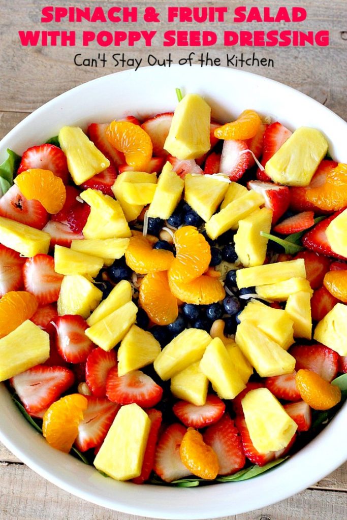 Spinach and Fruit Salad with Poppy Seed Dressing | this is one of our favorite #salad #recipes. It's filled with #strawberries, #Blueberries, #pineapple & #MandarinOranges. It also has #Cashews & #SwissCheese. No one can resist this amazing #TossedSalad! We serve it for company all the time. #holiday #HolidaySalad #TossedSaladWithFruit #SpinachSalad #SpinachAndFruitSaladWithPoppySeedDressing #PoppySeedDressing #GlutenFree #Healthy #HealthySaladRecipe
