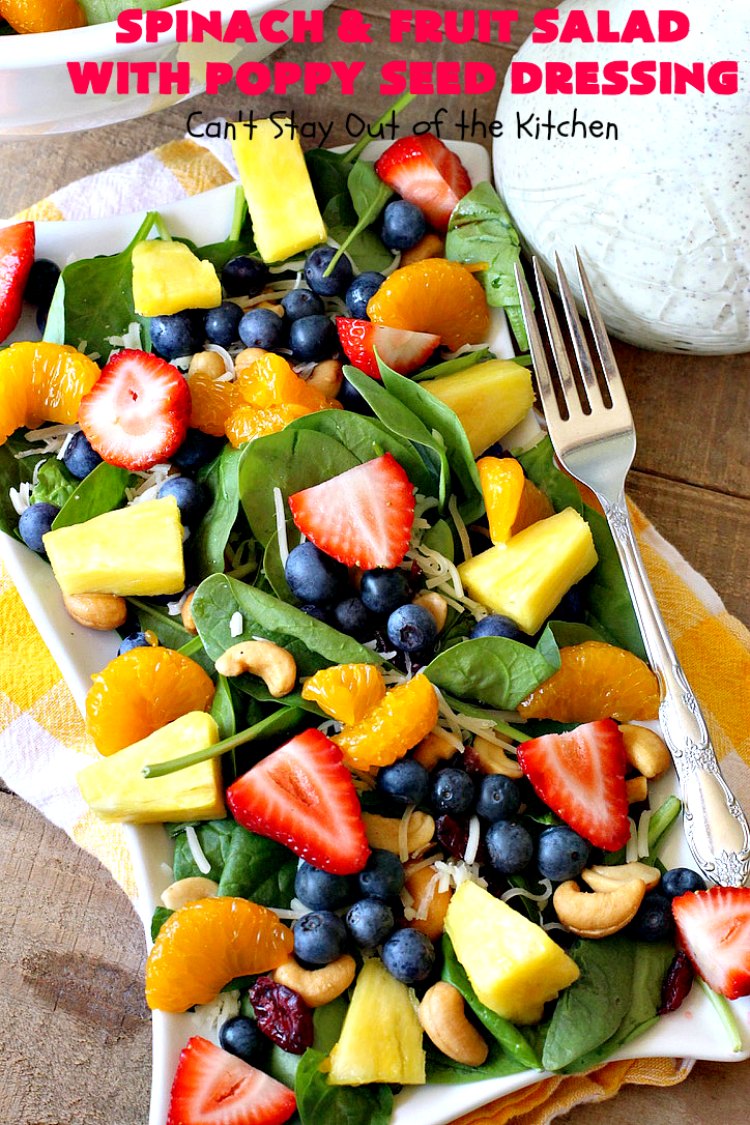 Spinach and Fruit Salad with Poppy Seed Dressing | this is one of our favorite #salad #recipes. It's filled with #strawberries, #Blueberries, #pineapple & #MandarinOranges. It also has #Cashews & #SwissCheese. No one can resist this amazing #TossedSalad! We serve it for company all the time. #holiday #HolidaySalad #TossedSaladWithFruit #SpinachSalad #SpinachAndFruitSaladWithPoppySeedDressing #PoppySeedDressing #GlutenFree #Healthy #HealthySaladRecipe