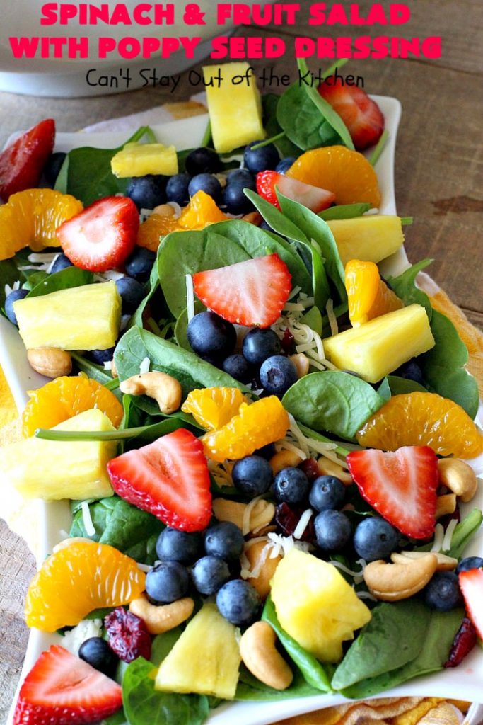 Spinach and Fruit Salad with Poppy Seed Dressing | this is one of our favorite #salad #recipes. It's filled with #strawberries, #Blueberries, #pineapple & #MandarinOranges. It also has #Cashews & #SwissCheese. No one can resist this amazing #TossedSalad! We serve it for company all the time. #holiday #HolidaySalad #TossedSaladWithFruit #SpinachSalad #SpinachAndFruitSaladWithPoppySeedDressing #PoppySeedDressing #GlutenFree #Healthy #HealthySaladRecipe