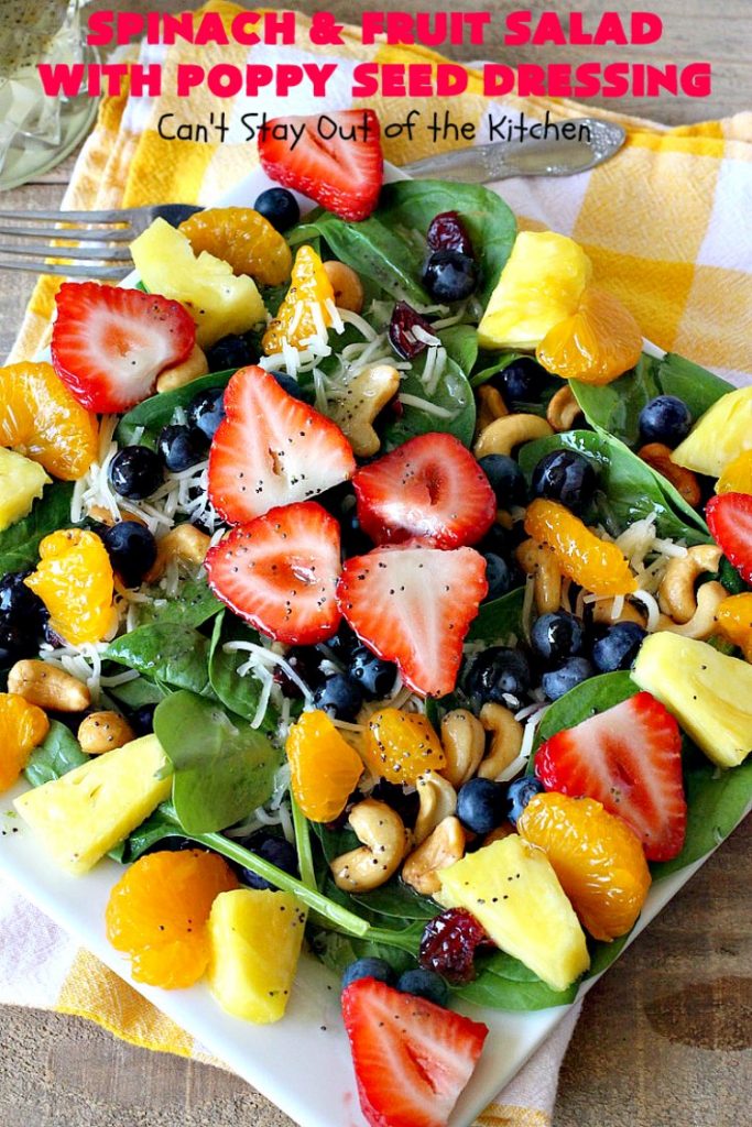 Spinach and Fruit Salad with Poppy Seed Dressing | this is one of our favorite #salad #recipes. It's filled with #strawberries, #Blueberries, #pineapple & #MandarinOranges. It also has #Cashews & #SwissCheese. No one can resist this amazing #TossedSalad! We serve it for company all the time. #holiday #HolidaySalad #TossedSaladWithFruit #SpinachSalad #SpinachAndFruitSaladWithPoppySeedDressing #PoppySeedDressing #GlutenFree #Healthy #HealthySaladRecipe