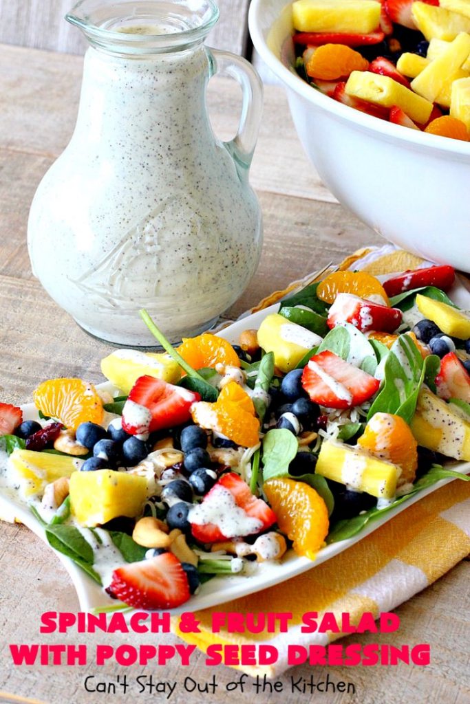 Spinach and Fruit Salad with Poppy Seed Dressing | this is one of our favorite #salad #recipes. It's filled with #strawberries, #Blueberries, #pineapple & #MandarinOranges. It also has #Cashews & #SwissCheese. No one can resist this amazing #TossedSalad! We serve it for company all the time. #holiday #HolidaySalad #TossedSaladWithFruit #SpinachSalad #SpinachAndFruitSaladWithPoppySeedDressing #PoppySeedDressing #GlutenFree #Healthy #HealthySaladRecipe