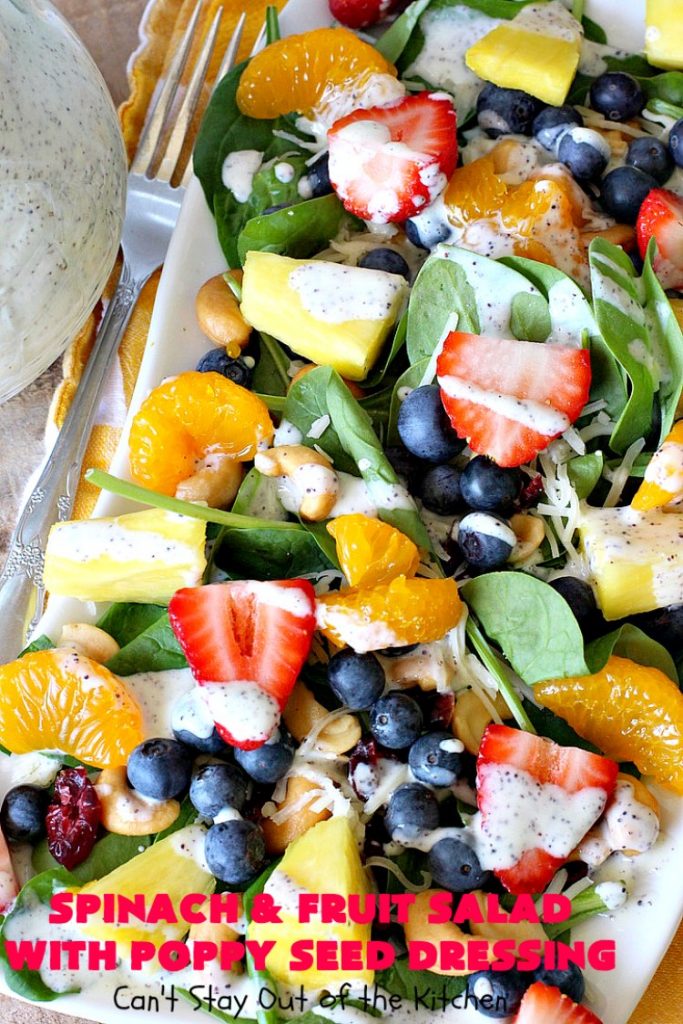 Spinach and Fruit Salad with Poppy Seed Dressing | this is one of our favorite #salad #recipes. It's filled with #strawberries, #Blueberries, #pineapple & #MandarinOranges. It also has #Cashews & #SwissCheese. No one can resist this amazing #TossedSalad! We serve it for company all the time. #holiday #HolidaySalad #TossedSaladWithFruit #SpinachSalad #SpinachAndFruitSaladWithPoppySeedDressing #PoppySeedDressing #GlutenFree #Healthy #HealthySaladRecipe