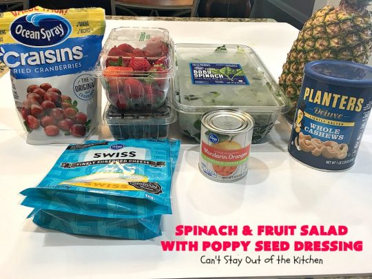Spinach and Fruit Salad with Poppy Seed Dressing | this is one of our favorite #salad #recipes. It's filled with #strawberries, #Blueberries, #pineapple & #MandarinOranges. It also has #Cashews & #SwissCheese. No one can resist this amazing #TossedSalad! We serve it for company all the time. #holiday #HolidaySalad #TossedSaladWithFruit #SpinachSalad #SpinachAndFruitSaladWithPoppySeedDressing #PoppySeedDressing #GlutenFree #Healthy #HealthySaladRecipe