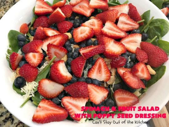 Spinach and Fruit Salad with Poppy Seed Dressing | this is one of our favorite #salad #recipes. It's filled with #strawberries, #Blueberries, #pineapple & #MandarinOranges. It also has #Cashews & #SwissCheese. No one can resist this amazing #TossedSalad! We serve it for company all the time. #holiday #HolidaySalad #TossedSaladWithFruit #SpinachSalad #SpinachAndFruitSaladWithPoppySeedDressing #PoppySeedDressing #GlutenFree #Healthy #HealthySaladRecipe