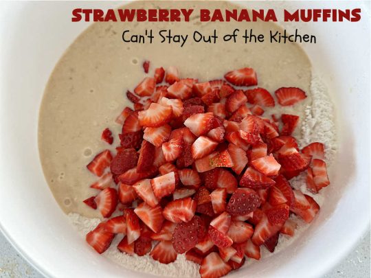 Strawberry Banana Muffins | Can't Stay Out of the Kitchen | These fantastic #strawberry #muffins include #applesauce & #bananas to keep them moist & #strawberries to provide pop in flavor & texture. Every bite will knock your socks off! Add a cup of #coffee & you're good to go! Also great for a company or #holiday #breakfast #menu. #StrawberryMuffins #StrawberryBananaMuffins
