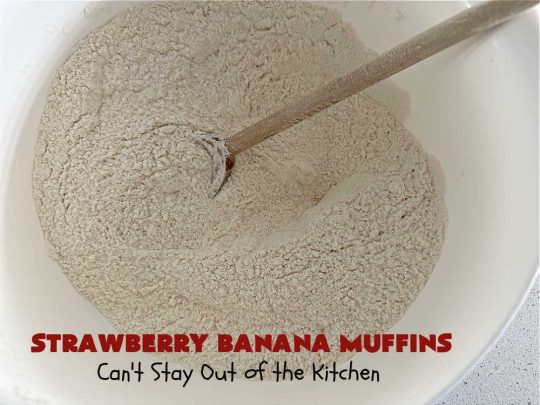 Strawberry Banana Muffins | Can't Stay Out of the Kitchen | These fantastic #strawberry #muffins include #applesauce & #bananas to keep them moist & #strawberries to provide pop in flavor & texture. Every bite will knock your socks off! Add a cup of #coffee & you're good to go! Also great for a company or #holiday #breakfast #menu. #StrawberryMuffins #StrawberryBananaMuffins
