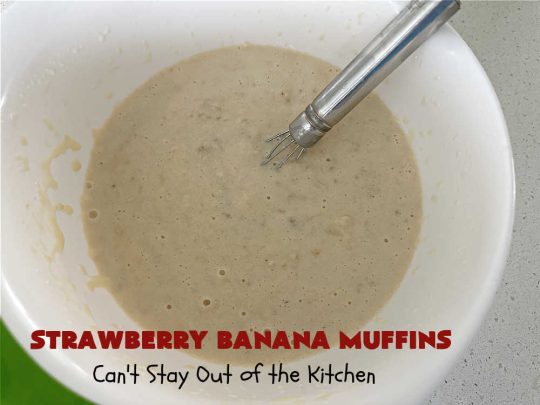 Strawberry Banana Muffins | Can't Stay Out of the Kitchen | These fantastic #strawberry #muffins include #applesauce & #bananas to keep them moist & #strawberries to provide pop in flavor & texture. Every bite will knock your socks off! Add a cup of #coffee & you're good to go! Also great for a company or #holiday #breakfast #menu. #StrawberryMuffins #StrawberryBananaMuffins