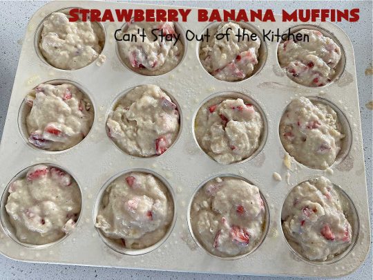 Strawberry Banana Muffins | Can't Stay Out of the Kitchen | These fantastic #strawberry #muffins include #applesauce & #bananas to keep them moist & #strawberries to provide pop in flavor & texture. Every bite will knock your socks off! Add a cup of #coffee & you're good to go! Also great for a company or #holiday #breakfast #menu. #StrawberryMuffins #StrawberryBananaMuffins 