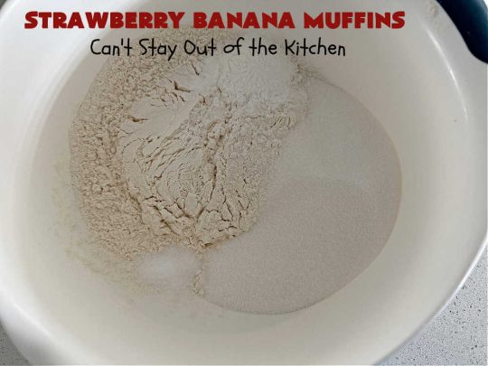 Strawberry Banana Muffins | Can't Stay Out of the Kitchen | These fantastic #strawberry #muffins include #applesauce & #bananas to keep them moist & #strawberries to provide pop in flavor & texture. Every bite will knock your socks off! Add a cup of #coffee & you're good to go! Also great for a company or #holiday #breakfast #menu. #StrawberryMuffins #StrawberryBananaMuffins