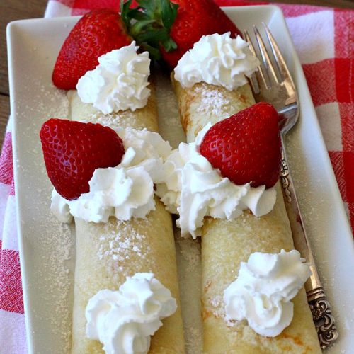 Strawberry Breakfast Crêpes | Can't Stay Out of the Kitchen | these lovely crêpes are filled with a luscious #strawberry filling. They're an excellent choice for a company or #holiday #breakfast. So rich & decadent they taste like eating #dessert! #BreakfastCrêpes #StrawberryBreakfastCrêpes