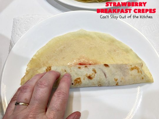 Strawberry Breakfast Crêpes | Can't Stay Out of the Kitchen | these lovely crêpes are filled with a luscious #strawberry filling. They're an excellent choice for a company or #holiday #breakfast. So rich & decadent they taste like eating #dessert! #BreakfastCrêpes #StrawberryBreakfastCrêpes