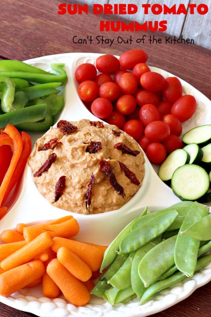 Sun Dried Tomato Hummus | Can't Stay Out of the Kitchen | this #hummus #recipe is fantastic! It includes #SunDriedTomatoes & just a little heat from cayenne pepper. This amazing #appetizer is healthy, low calorie, #GlutenFree & #vegan. Plus it can be whipped up in about 5 minutes! #tailgating #GarbanzoBeans #SunDriedTomatoHummus