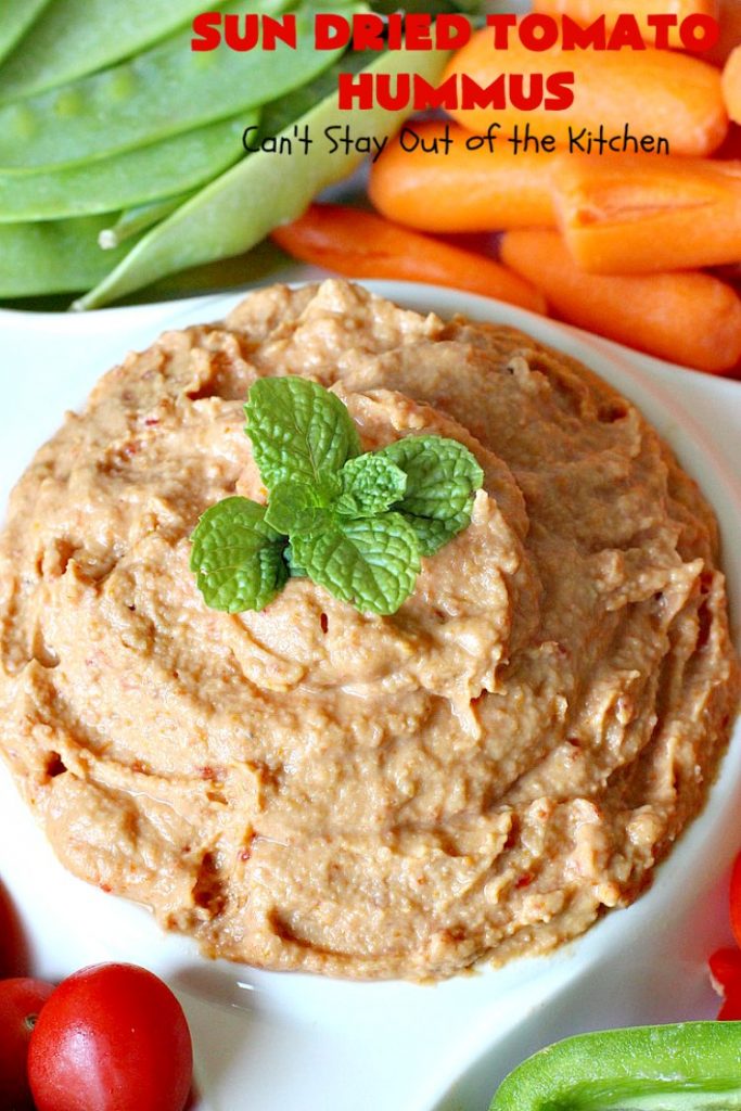 Sun Dried Tomato Hummus | Can't Stay Out of the Kitchen | this #hummus #recipe is fantastic! It includes #SunDriedTomatoes & just a little heat from cayenne pepper. This amazing #appetizer is healthy, low calorie, #GlutenFree & #vegan. Plus it can be whipped up in about 5 minutes! #tailgating #GarbanzoBeans #SunDriedTomatoHummus