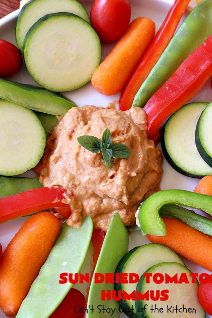 Sun Dried Tomato Hummus | Can't Stay Out of the Kitchen | this #hummus #recipe is fantastic! It includes #SunDriedTomatoes & just a little heat from cayenne pepper. This amazing #appetizer is healthy, low calorie, #GlutenFree & #vegan. Plus it can be whipped up in about 5 minutes! #tailgating #GarbanzoBeans #SunDriedTomatoHummus