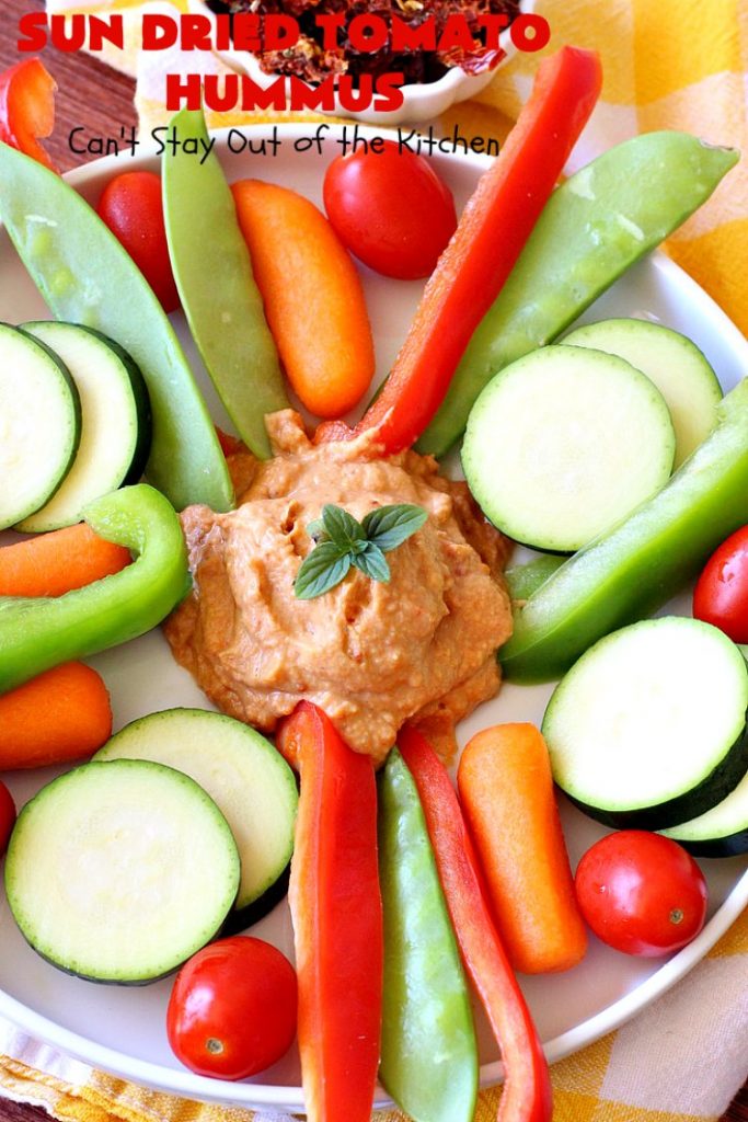 Sun Dried Tomato Hummus | Can't Stay Out of the Kitchen | this #hummus #recipe is fantastic! It includes #SunDriedTomatoes & just a little heat from cayenne pepper. This amazing #appetizer is healthy, low calorie, #GlutenFree & #vegan. Plus it can be whipped up in about 5 minutes! #tailgating #GarbanzoBeans #SunDriedTomatoHummus