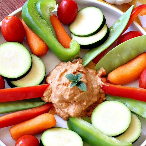 Sun Dried Tomato Hummus | Can't Stay Out of the Kitchen | this #hummus #recipe is fantastic! It includes #SunDriedTomatoes & just a little heat from cayenne pepper. This amazing #appetizer is healthy, low calorie, #GlutenFree & #vegan. Plus it can be whipped up in about 5 minutes! #tailgating #GarbanzoBeans #SunDriedTomatoHummus