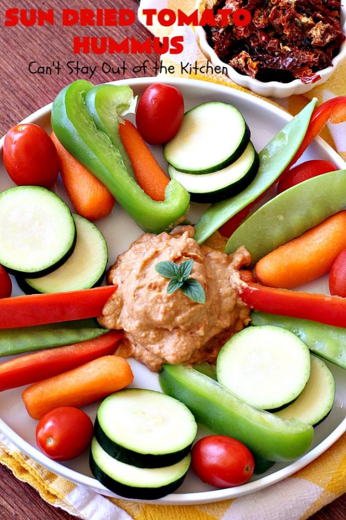 Sun Dried Tomato Hummus | Can't Stay Out of the Kitchen | this #hummus #recipe is fantastic! It includes #SunDriedTomatoes & just a little heat from cayenne pepper. This amazing #appetizer is healthy, low calorie, #GlutenFree & #vegan. Plus it can be whipped up in about 5 minutes! #tailgating #GarbanzoBeans #SunDriedTomatoHummus