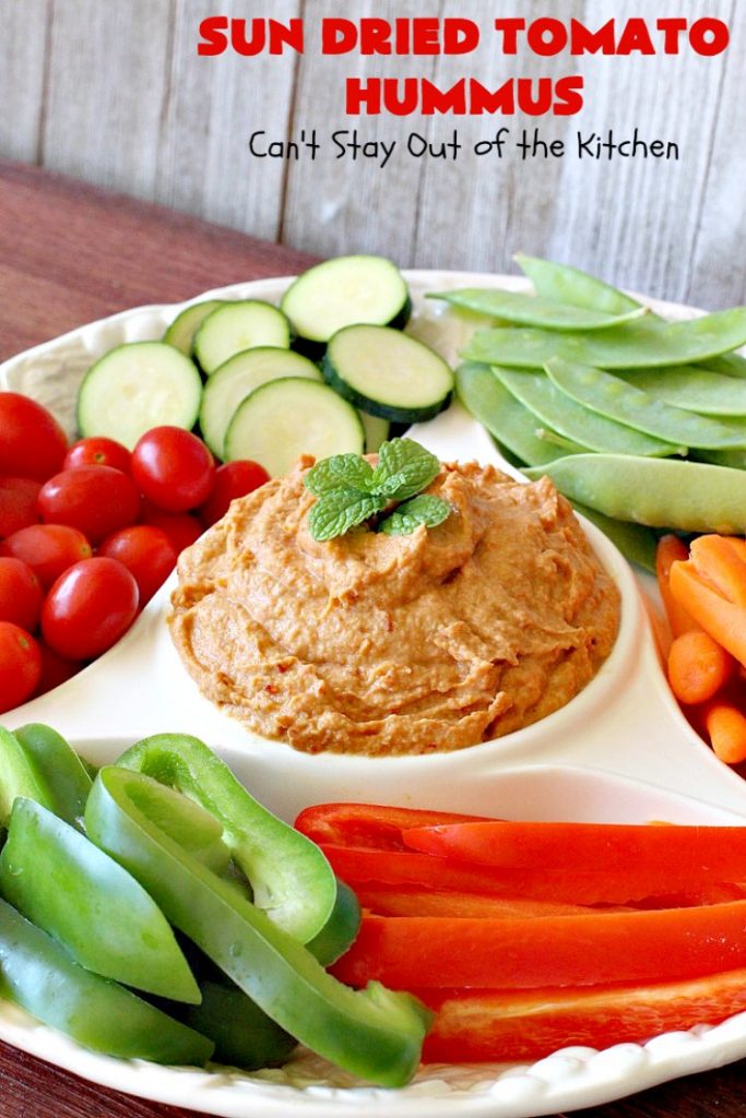 Sun Dried Tomato Hummus | Can't Stay Out of the Kitchen | this #hummus #recipe is fantastic! It includes #SunDriedTomatoes & just a little heat from cayenne pepper. This amazing #appetizer is healthy, low calorie, #GlutenFree & #vegan. Plus it can be whipped up in about 5 minutes! #tailgating #GarbanzoBeans #SunDriedTomatoHummus