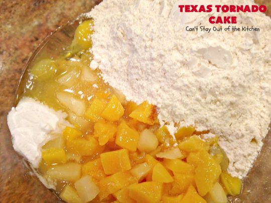 Texas Tornado Cake | Can't Stay Out of the Kitchen | this quick & easy #cake #recipe looks like a tornado hit it after baking! It's filled with #walnuts and #FruitCocktail. The #caramelized icing contains #coconut. This vintage cake will knock your socks off! #dessert #TexasTornadoCake #FruitCocktailCake #peaches #pears #EasyDessertRecipe #Holiday #HolidayDessert #ValentinesDay #ValentinesDayDessert