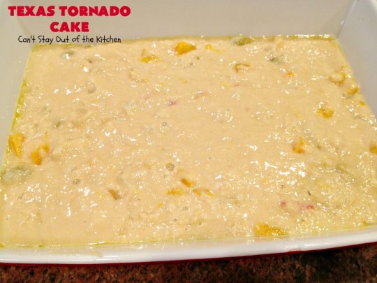 Texas Tornado Cake | Can't Stay Out of the Kitchen | this quick & easy #cake #recipe looks like a tornado hit it after baking! It's filled with #walnuts and #FruitCocktail. The #caramelized icing contains #coconut. This vintage cake will knock your socks off! #dessert #TexasTornadoCake #FruitCocktailCake #peaches #pears #EasyDessertRecipe #Holiday #HolidayDessert #ValentinesDay #ValentinesDayDessert