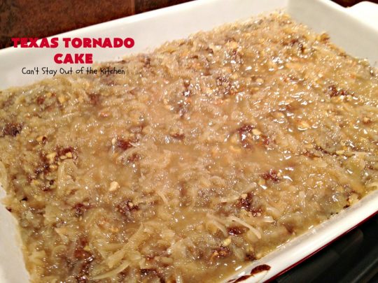 Texas Tornado Cake | Can't Stay Out of the Kitchen | this quick & easy #cake #recipe looks like a tornado hit it after baking! It's filled with #walnuts and #FruitCocktail. The #caramelized icing contains #coconut. This vintage cake will knock your socks off! #dessert #TexasTornadoCake #FruitCocktailCake #peaches #pears #EasyDessertRecipe #Holiday #HolidayDessert #ValentinesDay #ValentinesDayDessert