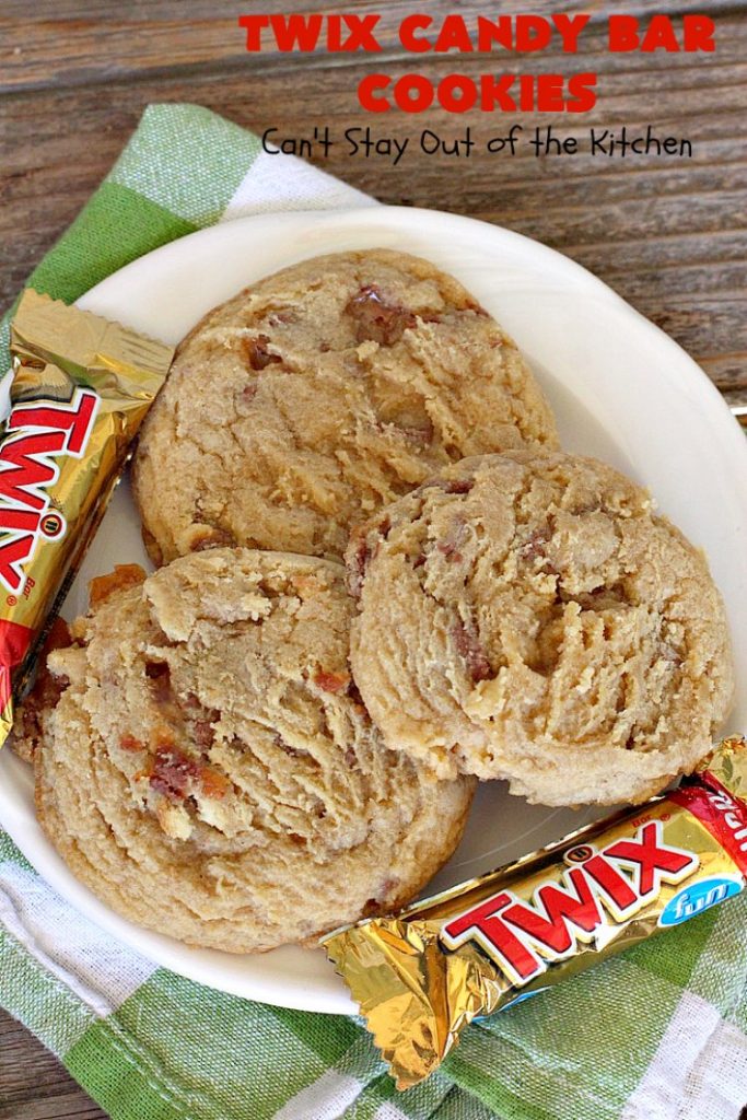 Twix Candy Bar Cookies | Can't Stay Out of the Kitchen | these fantastic #cookies are to die for! They're filled with #TwixCandyBars so they have great #chocolate & #caramel taste. We gave them out for a local town Christmas celebration & hundreds of folks raved over these goodies. #dessert #Holiday #HolidayDessert #CaramelDessert #ChocolateDessert #TwixCandyBarDessert #TwixCandyBarCookies #ChristmasCookieExchange #tailgating