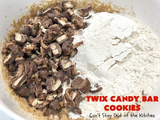 Twix Candy Bar Cookies | Can't Stay Out of the Kitchen | these fantastic #cookies are to die for! They're filled with #TwixCandyBars so they have great #chocolate & #caramel taste. We gave them out for a local town Christmas celebration & hundreds of folks raved over these goodies. #dessert #Holiday #HolidayDessert #CaramelDessert #ChocolateDessert #TwixCandyBarDessert #TwixCandyBarCookies #ChristmasCookieExchange #tailgating