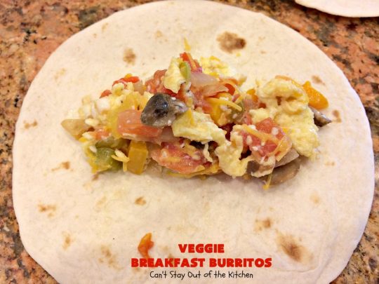 Veggie Breakfast Burritos | Can't Stay Out of the Kitchen | these delicious #burritos are terrific for on-the-go breakfasts. They can be refrigerated or frozen and microwaved just before you're heading out the door! This #healthy #breakfast option is wonderful for company or #MeatlessMondays too. #tomatoes #bellpeppers #mushrooms #tortillas #CheddarCheese #eggs #holiday #HolidayBreakfast #VeggieBreakfastBurritos #BreakfastBurritos #HealthyBreakfastBurritos