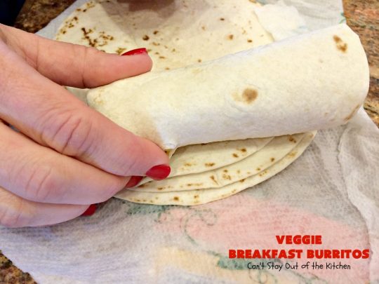 Veggie Breakfast Burritos | Can't Stay Out of the Kitchen | these delicious #burritos are terrific for on-the-go breakfasts. They can be refrigerated or frozen and microwaved just before you're heading out the door! This #healthy #breakfast option is wonderful for company or #MeatlessMondays too. #tomatoes #bellpeppers #mushrooms #tortillas #CheddarCheese #eggs #holiday #HolidayBreakfast #VeggieBreakfastBurritos #BreakfastBurritos #HealthyBreakfastBurritos