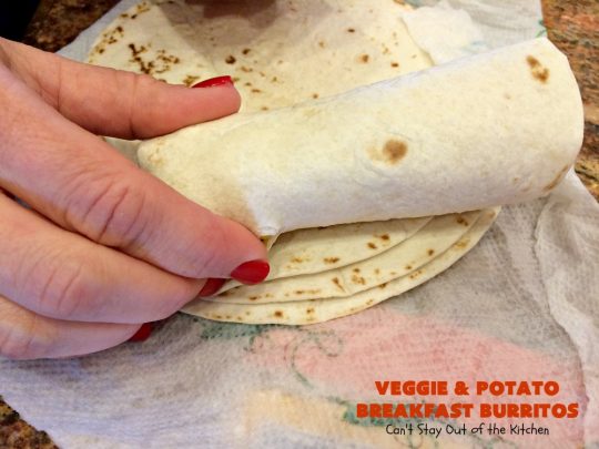 Veggie and Potato Breakfast Burritos | Can't Stay Out of the Kitchen | these delightful #BreakfastBurritos are awesome for a weekend, company or #holiday #breakfast. They can easily be prepared & frozen in advance & then microwaved before serving. Terrific for a grab and go breakfast too. #Tortillas #eggs #CheddarCheese #mushrooms #potatoes #Vegetarian #vegetables #VeggieAndPotatoBreakfastBurritos #brunch #HolidayBreakfast #MeatlessMondays